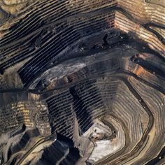 an aerial view of a coal mine in the middle of nowhere, taken from above