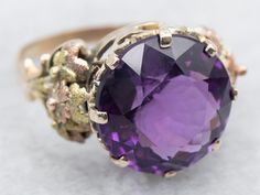 With a unique blend of yellow, green, and rose gold, this round-cut amethyst cocktail ring is sure to make a statement. Perfect for the vintage-loving individual who wants to add a touch of playfulness to their wardrobe. Shine on! Metal: 14K Yellow, Green, and Rose Gold Gem Amethyst 7.41 Carats Gem Measurements: 13.3 mm, Round Ring Size: 7.75 Marks: "14K" Stamped on the inside band SKU #: A46871 Each piece has been identified and graded by a Graduate Gemologist who has been certified by the Gemological Institute of America (GIA). We have six brick-and-mortar storefronts in Maine, Massachusetts, and New Hampshire and have been in business for over 25 years! Please visit our Shop's About Page or our website for more information about our jewelry. For questions about diamond grading, we recom Vintage Amethyst Ring, Amethyst Cocktail Ring, Amethyst Ring Vintage, Gold Amethyst Ring, Ring Birthstone, Amethyst Jewelry, Round Rings, Shine On, Ring Vintage