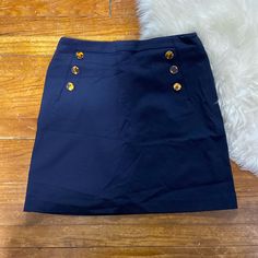 Nwt Skirt. Hidden Zipper In Back. Stretchy Material. Cute Button Detailing Down The Front Fitted Blue Skirt With Button Zip Fly, Fitted Blue Skirt, Blue Mini Skirt With Button Zip Fly, Blue Skort With Button Closure, Blue Short Skirt With Button Closure, Navy Blue Mini Skirt, Yellow Pencil Skirt, Pencil Skirt Work, Brocade Skirt