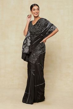 Black saree with sequin embroidered floral and linear pattern. Comes with matching embroidered blouse and a petticoat. - Aza Fashions Black Silk Embroidered Saree Fabric, Black Silk Embroidered Fabric For Diwali, Black Embroidered Saree Fabric, Black Silk Saree With Resham Embroidery, Black Silk Pre-draped Saree With Resham Embroidery, Elegant Black Pre-draped Saree With Intricate Embroidery, Black Silk Pre-draped Saree For Eid, Embroidered Traditional Wear For Evening Festivals, Traditional Embroidered Evening Wear