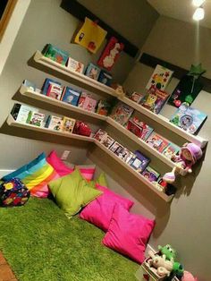 a child's bedroom with bookshelves and stuffed animals on the bed in it