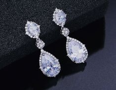 "Rhodium Crystal Silver Wedding Gauges Plugs earrings 1.75\" Long FOR GAUGES/STRETCHED EARLOBES: All styles come with internally threaded (screw on/off) double flare tunnels. You also have the option to add an o-ring (for $1) that can be worn with the screw on/off flares for extra security that can help with possible sagging, or by themselves without the screw on/off flares making it a single flare. REGULAR POSTS/EARRINGS (not gauges for stretched earlobes): If you would like REGULAR POSTS/EARRI Wedding Gauges, Bridal Gauges, Wedding Plugs, Pageant Jewelry, Unique Dangle Earrings, Pageant Earrings, Ear Tunnels, Ring Der O, Gauged Earrings