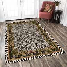 a living room with a leopard print rug on the floor