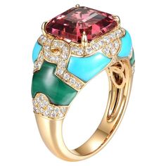 Introducing our stunning 18 karat yellow gold tourmaline cocktail ring, featuring a gorgeous 4.21 carat square cut tourmaline with a strong pink hue, surrounded by a handcrafted arrangement of turquoise and malachite stones. The intricate design is accented by 0.54 carats of diamonds, adding a touch of glamour and sophistication. The square cut tourmaline is the focal point of the piece, measuring 9.5mm x 9.5mm, and exudes a beautiful pink hue that catches the light in a striking way. The handcrafted turquoise and malachite stones are set in a way that beautifully complements the center stone, creating a unique and harmonious design. The ring is crafted from 18 karat yellow gold and is currently available in US size 6.5, with resizing options available to ensure a perfect fit. The ring's w Turquoise Stone Jewelry, Diamond Cocktail Ring, Malachite Stone, Diamond Cocktail Rings, Turquoise Rings, Square Cut, Gem Stone, Intricate Design, Cocktail Ring