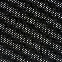 a black and white polka dot fabric with small dots on the bottom half of it