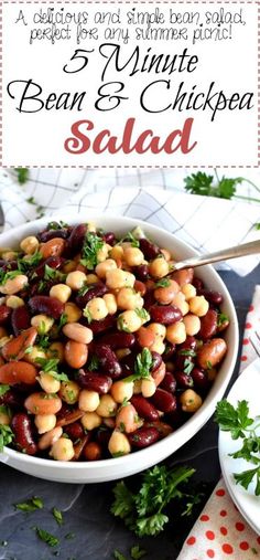 bean and chickpea salad in a white bowl with parsley on the side