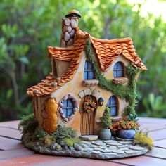 These clay houses are the perfect way to add a touch of whimsy to your fairy tale themed decor. Clay House Ideas, Babysitting Crafts, Miniature Diorama, Fairy House Crafts, Clay House, Fairytale House, Clay Fairy House, Ceramic Birdhouse, Fairy Garden Designs