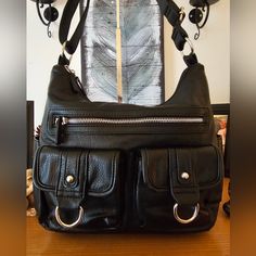 Bueno Black Faux Leather Bag. Super Soft Adjustable Strap Silver Hardware Front Zip 2. Front Snap Pouches. Double Top Zip. 2 Slip Pockets In Front Zip Compartment No Callouts. Bag Looks Brand New. No Scuffs, Stains Or Tears Measures 14"W X 10"H Black Satchel With Zipper Pocket For Errands, Faux Leather Bag, Black Faux Leather, Silver Hardware, Leather Shoulder Bag, Leather Bag, Adjustable Straps, Faux Leather, Bag Lady