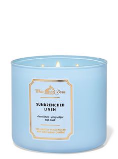 a blue candle that is sitting on a white surface with the words, sundrened linen