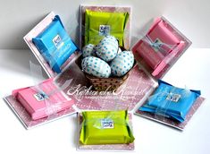 a basket filled with lots of different types of soaps on top of a table