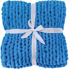 two blue knitted blankets wrapped in white ribbon and tied with a bow on top