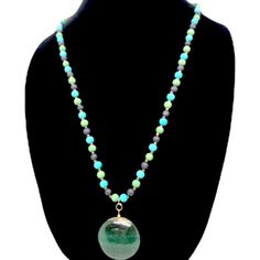 This lovely nature-inspired handcrafted Kindness necklace is guaranteed to elicit a smile! Artfully constructed with real jade, stone, and beads, this stunning piece of jewelry is a reminder of the joy of benevolence. The cheerful warmth of the beads symbolizes the kindness we all share. A thoughtful present for anyone seeking to express their benevolent spirit, the Kindness necklace is an inspiring gift!. Length: 15" Kindness Jade Pendant Necklace with Gold, Turquoise, and Green Beads Embrace compassion with our stunning Kindness Jade Pendant Necklace. This beautiful piece features: 15" beaded chain with gold, turquoise, and green accents Gold clasp and seed beads for secure wear Handcrafted with care for quality and durability Let this necklace gently remind you to spread kindness wherev Jade Pendant Necklace, Pendant Necklace Gold, Spread Kindness, Green Beads, Green Accents, Jade Stone, Jade Pendant, Nature Jewelry, Green Bead