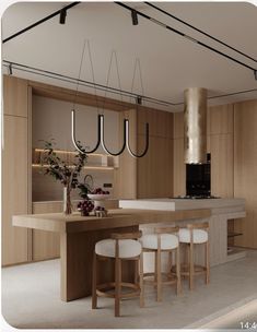 a modern kitchen with wooden cabinets and white stools