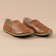 Brown Leather Slip-on Shoes With Stitched Sole, Comfortable Leather Shoes With Stitched Sole And Almond Toe, Comfortable Almond Toe Leather Shoes With Stitched Sole, Brown Slip-on Walking Shoes With Stitched Sole, Comfortable Leather Shoes With Plain Toe, Artisan Brown Slip-on Moccasins, Brown Closed Toe Loafers With Soft Sole, Brown Leather Loafers With Soft Sole, Brown Leather Shoes With Soft Sole