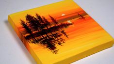 an orange and yellow painting with trees on it