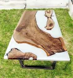 a coffee table made out of wood and metal in the shape of a tree trunk