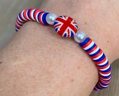 The Beadbound Jewellery💜 Union Jack bracelet is a fun, patriotic piece of jewellery that is perfect for a royal, patriotic or sporting event 🇬🇧. These are my most popular bracelets to date!! Made by hand, the bracelet is made with red, white and blue clay beads and finished with 2 pearl like beads and a Union Jack charm bead for added decoration. The beads are threaded on to elastic string so the bracelets will stretch to fit your wrist, but while care is taken to secure the beads, please don't overstretch them to avoid damage. Due to the bracelet being made with small beads it is not recommended for children younger than 3 years. I provide FREE UK 2nd class  delivery (estimated delivery 2-4 days from posting). Tracked international shipping is also available via Royal Mail. All orders Popular Bracelets, Blue Clay, Sporting Event, Small Beads, Union Jack, Clay Beads, Sport Event, Red White And Blue, Bracelet Sizes