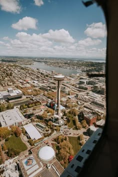 an aerial view of a city and water tower