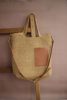 I create premium quality raffia bags. If you order this model of raffia shoulder bag from me, you will definitely fall in love with it. Why? Because this straw tote bag is very comfortable and spacious. Secondly, it is handmade from premium materials for the most discerning and demanding people. And the third reason to buy such a raffia shoulder bag is that it is a trendy model that can be carried in your hands, on your shoulder or over your shoulder. You can use this large straw shoulder bag for a trip to the beach, for a walk in the city, or take it with you on a date. There is a casual straw and leather tote bag for going out for a walk. There is a removable cotton lining with buttons inside the bag. You can easily remove it and wash it. There is a small pocket for small items. The stra Beige Straw Bag With Leather Handles, Natural Canvas Shoulder Bag With Leather Handles, Natural Shoulder Bag With Leather Handles, Chic Beige Handwoven Hobo Bag, Handwoven Beige Double Handle Shoulder Bag, Jute Straw Bag With Double Leather Handles, Natural Fiber Bucket Bag With Leather Handles, Handwoven Beige Shoulder Bag With Double Handle, Double Handle Jute Straw Bag With Leather Handles