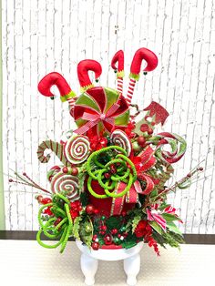 a christmas centerpiece with candy canes and candies