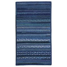 a blue rug with stripes on the bottom and one stripe at the top, in different colors