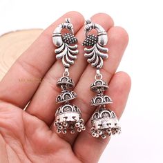 Peacock Silver Dangle Earring, Jhumka Silver Earring, Oxidized Dangle Drop Earring, 925 Sterling Silver Earring, Cyber Monday Sale ✦ ✦ METAL DETAILS✦ ✦  ✦ Metal : 925 Sterling Silver ✦ Earring Size : 68X15 mm  ✦ Total Weight : 28.52 Gram  ✦ Earring Box : Yes ✦ CUSTOMISATION DETAILS✦ We can customize any piece of fine jewelry. You can simply message us on Etsy or drop a text at +91-7357229656 (WhatsApp/I Message) to let us know about all the customization you want. Customization can include : ✦ Metal Type: 9K Gold, 10K Gold, 14K Gold, 18K Gold, 22K Gold, 925 Sterling Silver (All designs) ✦ Any Other Request: Your dream it appears can make it! Let us know about any request you have and we will get it done for you! ✦ Have your own custom design? Send us a message and we will make it for you e Earrings Bird, Vintage Silver Earrings, Dangle Earrings Silver, Peacock Earrings, Earring Box, Silver Earring, Silver Earrings Dangle, 925 Sterling Silver Earrings, Boho Earrings