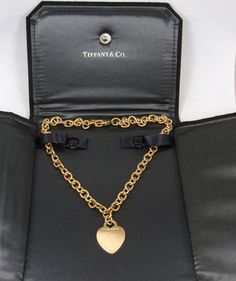 Gorgeous Authentic Tiffany & Co. 18K Yellow Gold Heart Tag Choker Necklace in excellent condition. The Necklace is 16" long. Heart Tag 20.7 mm X 26.8 mmHallmarked "Tiffany & Co. 750". Heavy 51.72 grams. Discontinued and no longer in production. Comes with Tiffany & Co black suede display case.0867 Tiffany Gold Necklace, Scarab Beetle Ring, Tiffany Gold, Chunky Gold Necklaces, Tiffany Necklace, Vintage Tiffany, Heart Tag, Tiffany And Co, Chunky Necklace