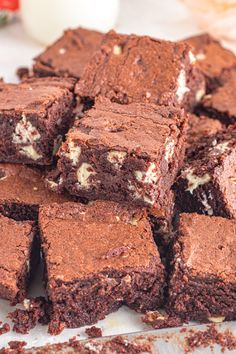 a pile of brownies sitting on top of a table