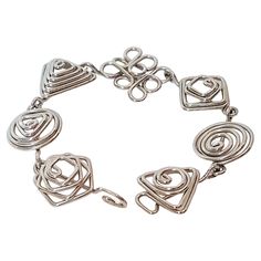 This modern one-of-a-kind geometric-spirals seven-link bracelet was expertly handmade from silver wire dating to the 20th Century in a style not earlier than Art Deco. There are no marks or jewelry techniques other than from the pliers used to bend the wire into the seven differently-shaped links. If not by mid-century artist Alexander Calder, it is in the style of his thousands of pieces of plier-bent wire jewelry that were astonishingly all unique. This attractive bracelet with atypical three- Alexander Calder, Modern Bracelets, Jewelry Techniques, Wire Bracelet, Silver Wire, Wire Jewelry, Link Bracelets, Three Dimensional, Geometric Shapes