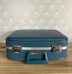 Excellent condition, this lightweight hard shell case has chrome latches, a swing handle and strong chrome trim. Inside is very clean with a quilted lining, a ruffled edge and mirror. No stains mirror is in perfect condition.  Would also make a great make up case. NO KEY INCLUDED  Measures  17"L x 12"W x6"D Classic Blue Rectangular Cases, Classic Blue Rectangular Case, Stained Mirror, Make Up Case, Vintage Luggage, Carry On Suitcase, Suitcase Traveling, Makeup Case, Suitcases