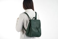 "This bag is made of high quality vegan leather in green. It is very soft and lightweight but durable. It has a rustic, distressed look. It has one interior and one exterior zipper pocket. Straps are adjustable. It is suitable for both men and women. There is two size option: Small : 17 x 27 x 30 cm Large : 20 x 30 x 36 cm IMPORTANT! Your orders between 7-25 August will be shipped on August 28. Delivery takes 2-5 days to the US, Canada, Australia and Europe; in 3-7 days to rest of the world afte Rectangular Green Leather Backpack, Green Leather Rectangular Backpack, Green Rectangular Leather Backpack For Daily Use, Rectangular Green Leather Backpack For Daily Use, Trendy Green Leather Backpack For Travel, Trendy Green Leather Backpack With Adjustable Strap, Trendy Green Leather Backpack For School, Trendy Green Leather Standard Backpack, Green Leather Backpack For Daily Use