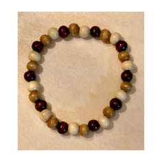 This Handmade Bracelet For Adult Or Child Consists Of Neutral Colors Bracelet Size Is 7.5", But Can Be Sized Up Due To The Elastic Wood Stains Are Of Off-White, Tan, And Walnut-Brown Hues Due To Material And Coloring, Beads Will Vary Looks Great With Other Wood, Metal, And Stone Bracelets Great Gift For You Or Someone Else Bundle And Save On Shipping Make Me An Offer Beige Bracelets With Wooden Round Beads, Beige Wooden Beaded Bracelets, Beige Wooden Beads Bracelets As Gift, Brown Wooden Beads For Bracelets, Beige Wooden Beads Bracelet As Gift, Brown Beaded Bracelets With Round Beads For Gift, Casual Natural Jewelry With Wooden Beads, Brown Wooden Beaded Bracelet, Casual Cream Beaded Bracelets As Gift