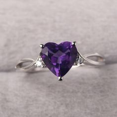 ◆ The ring is handcrafted from sterling silver and decorated with a dazzling 8*8 mm amethyst and CZs. It is suitable for engagement/anniversary/daily occasion. ◆ Production Description: Main stone Type: Natural Amethyst Main Stone Shape: Heart Cut Main Stone Size: 8*8 mm(1.78ct) Side stone: CZ Metal: 925 Sterling silver - Other options available in the drop down menu ◆ Customization: √Free for Add Engraving √Other Metal Type Available √Other Gemstones & Shapes Available √Personalization Requests Fine Jewelry Purple Rings With Diamond Accents, Elegant Purple Diamond Ring For Anniversary, Purple Rings With Diamond Accents For Wedding, Wedding Amethyst Diamond Ring With Diamond Accents, Wedding Amethyst Diamond Ring With Accents, Purple Diamond Ring With Diamond Accents For Anniversary, Elegant Heart-shaped Amethyst Ring With Accent Stones, Purple Diamond Ring With Accents For Anniversary, Elegant Amethyst Heart-shaped Birthstone Ring