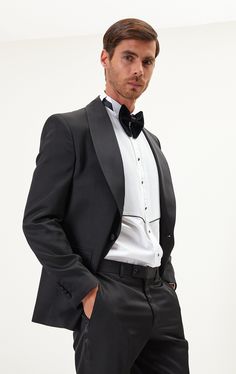 DETAILS If you find your evening event calendar filling up fast, it might be time to boost your black tie attire with a luxurious dinner jacket, like our classic black style. Made from a textured lustrous fabric with tactile irregularities on the surface, it's tailored with elegant shawl lapels and fastens with covered buttons for a streamlined finish. The full lining reinforces the fine cloth and means it'll layer smoothly over your shirt. The suit consists of a tuxedo jacket and a pair of pant Elegant Outerwear With Suit Collar For Semi-formal Occasions, Elegant Long Sleeve Evening Suits, Elegant Fitted Outerwear For Black-tie Events, Timeless Evening Suits With Long Sleeves, Elegant Semi-formal Outerwear With Suit Collar, Timeless Long Sleeve Evening Suits, Tuxedo Suits With Structured Boning And Long Sleeves, Black Tuxedo With Hidden Button Closure For Party, Designer Evening Suit With Lapel Collar