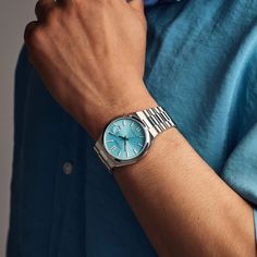 Redefine sophistication with the modern sports design of this men's Citizen Tsuyosa Collection automatic watch with a light blue sunray dial. The sky-blue sunray dial showcases luminous silver-toned hands and markers, and a date display at 3 o'clock. 40.0mm brushed stainless steel case with anti-reflective sapphire crystal Automatic movement keeps accurate time. The stainless steel bracelet features polished and brushed links and secures with a fold-over clasp. Water resistant to 50 meters, this watch includes a 5-year limited manufacturer warranty, with an additional 1-year warranty when you register your watch with Citizen. We are an authorized Citizen dealer. Citizen Tsuyosa, Citizen Watch, Best Watches For Men, Automatic Watches For Men, Blue Watches, Peoples Jewellers, Hand Watch, Dope Jewelry, Luxury Watches For Men