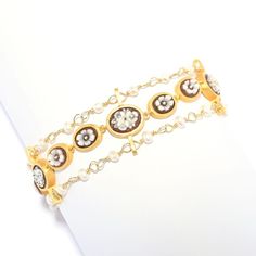 Make an elegant, eye-catching statement on your wrist with this Cameo Italiano "Anastasia" flower bracelet. Showcasing 11 carved shell cameos, it also has 24 freshwater cultured pearls. It's finely crafted in 18K yellow gold plated sterling silver with a polished finish that provides across-the-room gleam. Measuring 8.75", it has a 1.25" extender with three toggle rings to ensure it perfectly suits your style. You'll love showing this piece off! It's the perfect finishing touch to any ensemble. Elegant Festive Bracelet Jewelry, Elegant Festive Jewelry Bracelet, Luxury Adjustable Pearl Bangle Bracelet, Luxury Adjustable Bangle Pearl Bracelet, Adjustable Elegant Crystal Bracelet For Festive Occasions, Elegant Adjustable Crystal Bracelet For Festive Occasions, Elegant Adjustable Gold Bracelet For Festive Occasions, Adjustable Elegant Gold Bracelet For Festive Occasions, Elegant Adjustable Bracelets For Festive Occasions