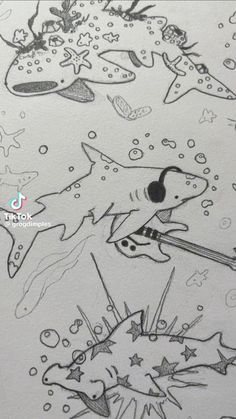 this is an image of a drawing of sharks in the water with stars and fish around them