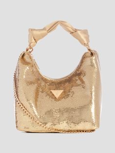 Sequin hobo bag Allover sequins Shiny gold-tone hardware Front signature triangle plaque Organized and lined interior Zip-top closure Satin top handle with 6" drop. Detachable chain strap with 18.75" drop. 8.25"W x 7.5"H x 4.75"D Bag Guess, Color Grouping, Satin Top, Sequin Top, Online Bags, Lifestyle Brand, Pink Bag, Hobo Bag, Lifestyle Brands