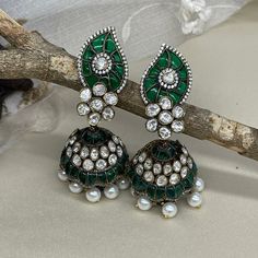 We bring beautiful Jewelry sure to elevate any look! Kindly pay attention to all photos and video and ask questions about the item prior to ordering. Bollywood Green Bridal Earrings For Reception, Green Kundan Chandbalis For Reception, Green Meenakari Bridal Earrings For Reception, Green Bridal Earrings For Reception On Diwali, Green Bridal Earrings For Reception At Diwali, Green Bridal Earrings For Reception During Diwali, Emerald Earrings For Wedding And Festivals, Traditional Green Jhumkas For Wedding, Green Meenakari Bridal Earrings For Wedding