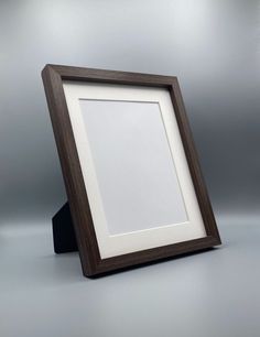 a wooden frame with a white background