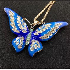 Blue Butterfly Pendant Necklace The Pendant Is Big The Color Is Blue And Golden The Butterfly’s Eyes Are Black Colored The Main Stone Is Crystal The Butterfly Has Crystals On It Long Chain Chain Length: 27.5” Pendant Size: 3.5” (Wing To Wing) Style, Chain Metal: Gold Plated Brand New Never Used Blue Butterfly Jewelry For Party, Crystal Butterfly Necklace, Big Pendant, Necklace Big, Crystal Butterfly, Butterfly Pendant Necklace, Big Blue, Butterfly Necklace, Butterfly Pendant