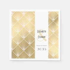 a gold and white wedding guest book with the words elizabeth and stephen on it's cover