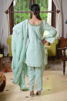 Sea green bell sleeve kurta, highlighted with placement floral embroidery. Paired with a pant and dupatta with zari stripes.
Components: 3
Pattern: Placement Embroidery
Type Of Work: Floral
Neckline: Round Neck
Sleeve Type: Bell Sleeves
Fabric: Cotton
Color: Green
Other Details: 
Length:
Kurta: 34 inches
Pant: 40 inches
Occasion: Puja - Aza Fashions Placement Embroidery, Kurta Pant Set, Pant Set For Women, Embroidery Floral, Kurta With Pants, Sea Green, Pant Set, Green Cotton, Set For Women