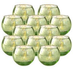 twelve green glass goblets with gold speckles