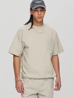 This is minimal single pocket T-shirt cut from seersucker fabric for soft touch and comfortable wear. It has relaxed fit with drawcord at hem to adjust silhouette.- Ribbed round neck- One chest pocket- Drop shoulder- Short sleeves- Adjustable drawcord at hem- Point logo label at side- Relaxed fit- Tentar and tumble finish to minimize distortion after wash Short Sleeve T-shirt With Pockets For Loungewear, Relaxed Fit Textured Crew Neck Top, Textured Relaxed Fit Crew Neck Top, Casual T-shirt With Side Pockets For Loungewear, Textured Casual Tops For Loungewear, Cotton T-shirt With Side Pockets For Loungewear, Casual Textured Crew Neck Top, Textured Crew Neck Casual Tops, Textured Casual Crew Neck Tops