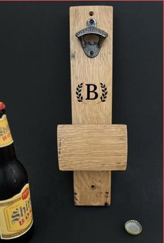 a bottle opener and two beer bottles on a table