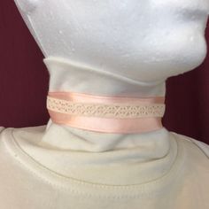 Have look proud and distinguished Lady of the Victorian era with this Ribbon and lace Choker necklace... or an air of Princess out of a fairy tale in her pink dress ruffled lace and Ribbon! Crew neck Ribbon necklaces was shaping or could even find it in beautiful costumes of Outlander. Satin ribbon, soft and silky with polished highlights. Cotton lace. The necklace is adjustable to a length between 12 and 15 inches. The Ribbon and an inch wide. The clasps, chains and clasp are silver colored. Vintage Ribbon Necklaces For Party, Elegant Beige Choker Necklace, Pink Vintage Choker Jewelry, Ribbon Choker Necklace For Weddings, Adjustable Pink Choker For Wedding, Pink Adjustable Choker For Wedding, Wedding Pink Adjustable Choker, Vintage Pink Choker Necklace, Pink Ribbon Jewelry For Formal Occasions