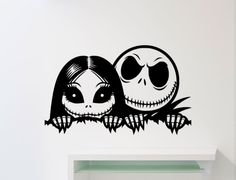 a wall sticker with two cartoon characters in the shape of jack and sally faces