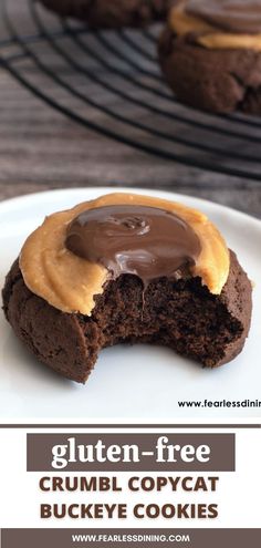 there is a chocolate cookie with peanut butter on it and the words gluten - free crumbl copycat buckeye cookies