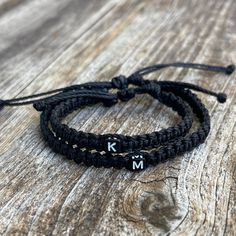 "These lovely bracelets are made with 1.5mm waterproof cord.  The \"Adult\" bracelet closes to around 6.5\". The \"Kid\" bracelet will fit a 5\" wrist. Both bracelets have an adjustable closure. To receive the Mommy and Me set, choose the \"1 Adult 1 Kid\" option. Please feel free to contact me if you have any question." Friendship Bracelets With Sliding Knot In Nylon Cord, Adjustable Letter Beads Wristband For Friendship, Adjustable Wristband With Letter Beads For Friendship, Casual Personalized Braided Bracelet For Friendship, Black Letter Beads Friendship Bracelets, Personalized Black Braided Bracelet For Everyday, Minimalist Personalized Black Friendship Bracelets, Black Personalized Braided Bracelet For Everyday, Minimalist Adjustable Black Name Bracelet